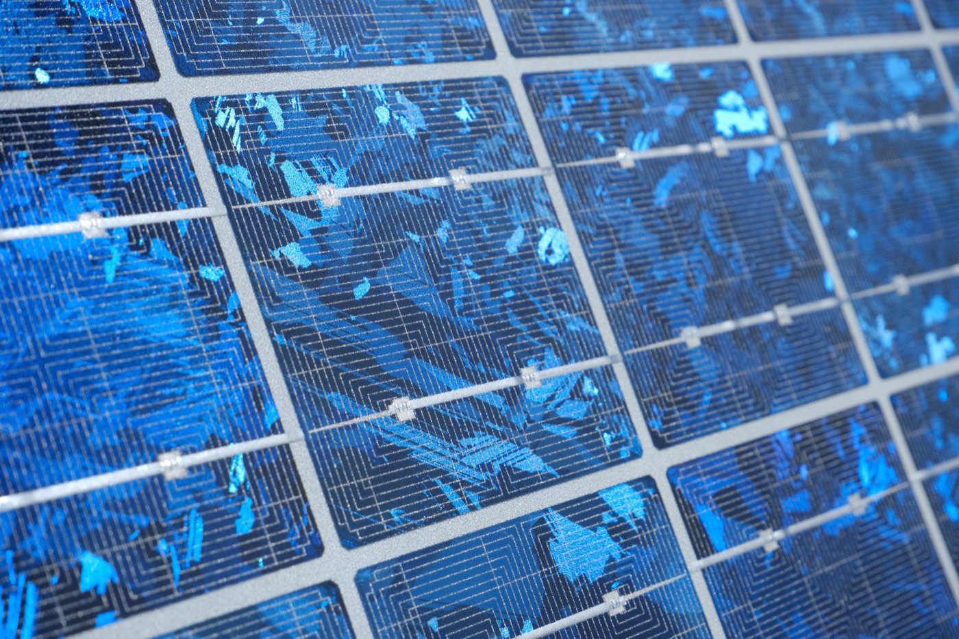 Close-up view of a polycrystalline solar photovoltaic panel showing individual cells