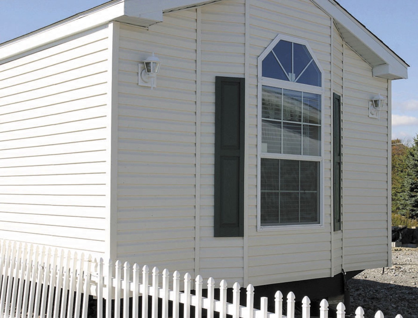 Exterior of a modern single-wide manufactured home with vinyl siding